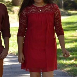 Red dress with lace sleeves and shoulders
